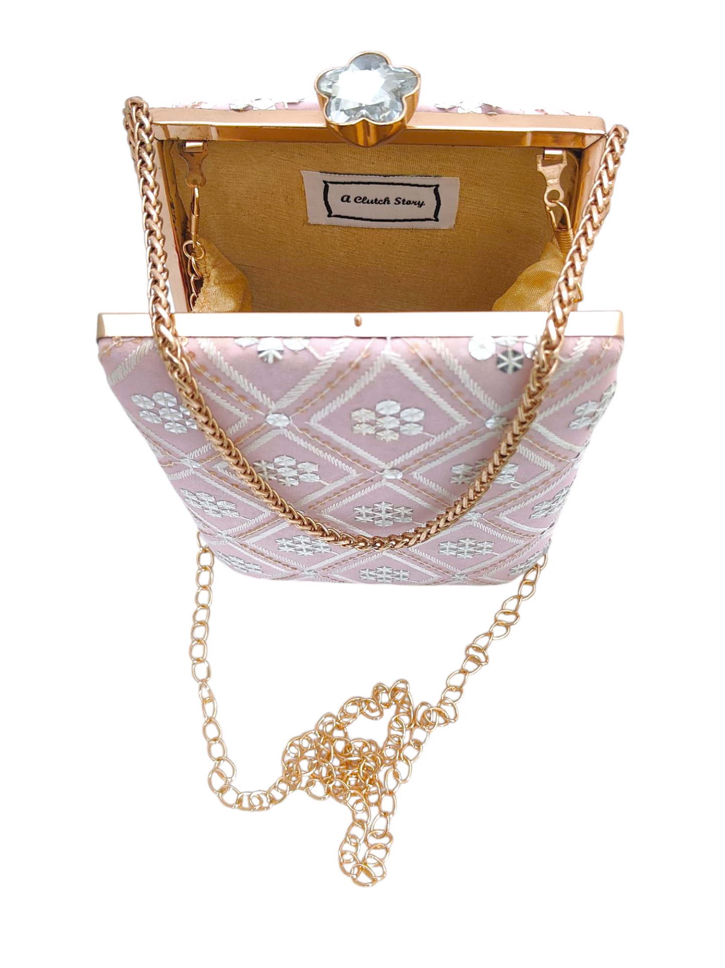 Dusty pink Fajr clutch by aclutchstory featuring a sleek, compact design with a textured surface and elegant gold-tone hardware.