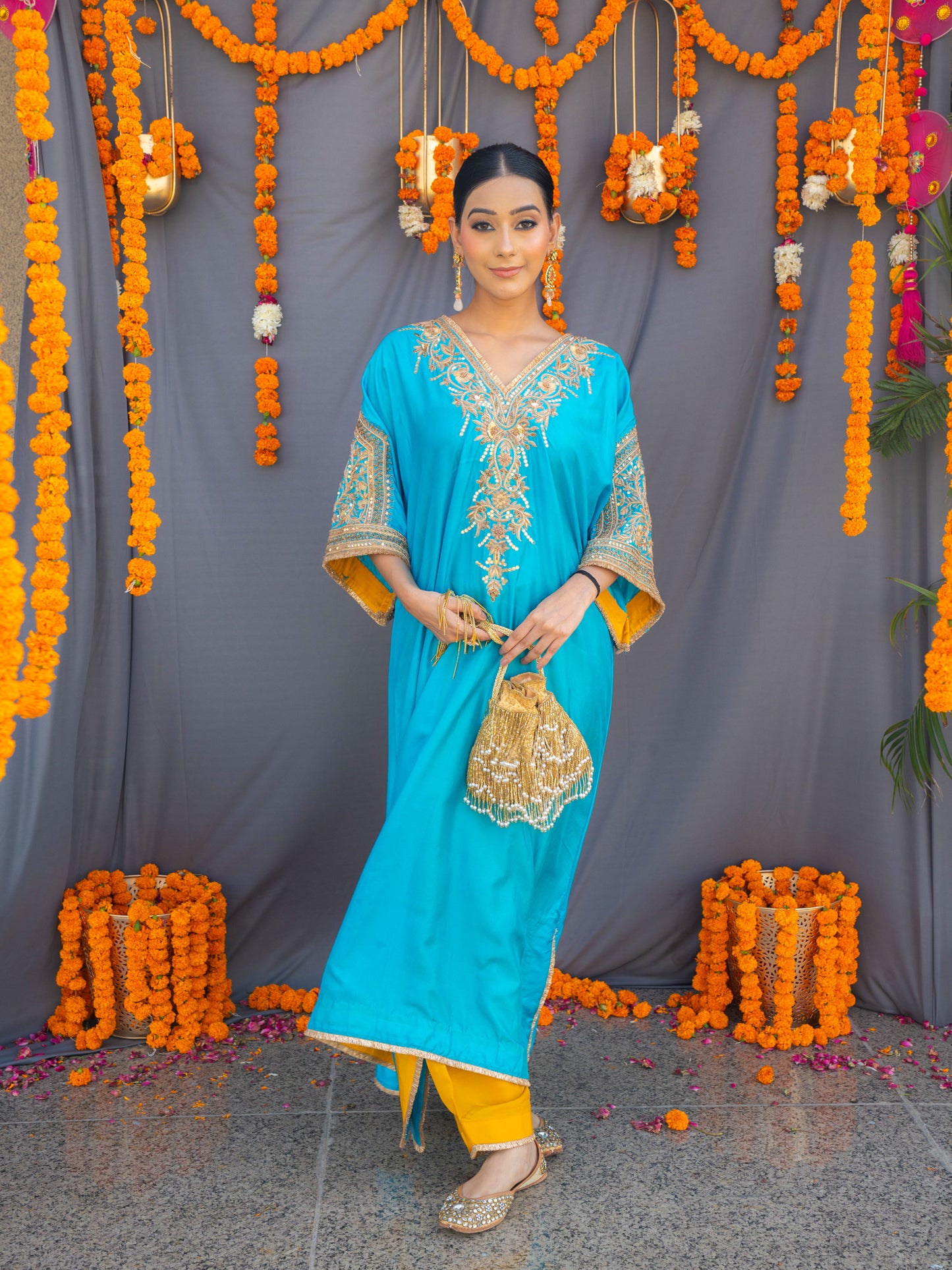 Gold fringe glam potli bag by aclutchstory with intricate design and drawstring closure, perfect for festive occasions.