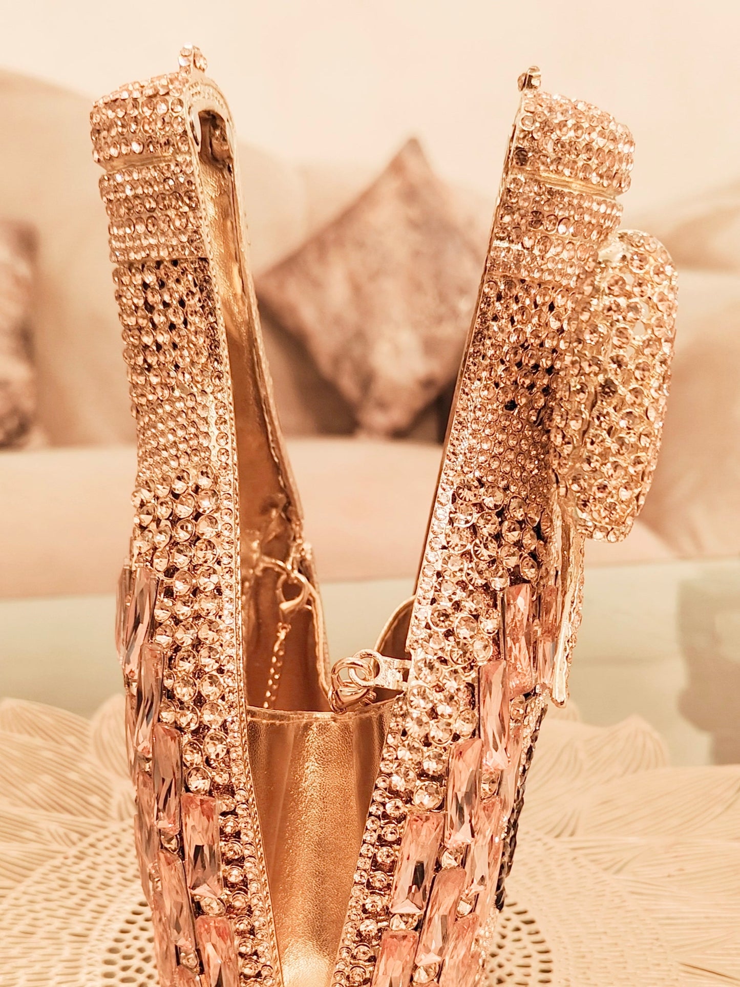 Rose gold champagne-shaped crystal clutch by aclutchstory, elegant evening bag with sparkling crystal details and a sleek design.