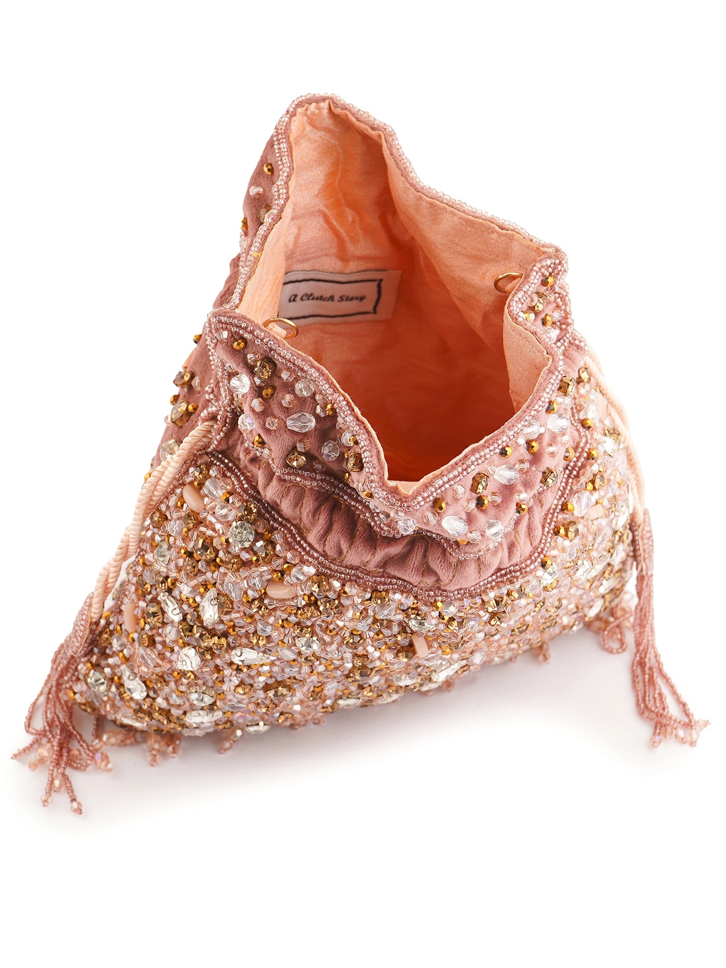 Hand-embroidered Phoolrani Potli Bag with intricate floral design by aclutchstory, shown with traditional fabric and decorative tassels.