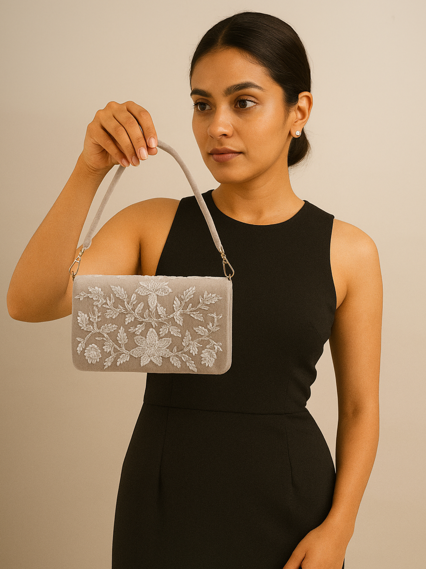 Hand-embroidered Sitara flapover clutch by aclutchstory featuring intricate embroidery and a stylish design.