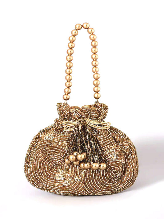 Antique gold matka potli bag from aclutchstory, featuring intricate design, seen on Anjum Fakih.