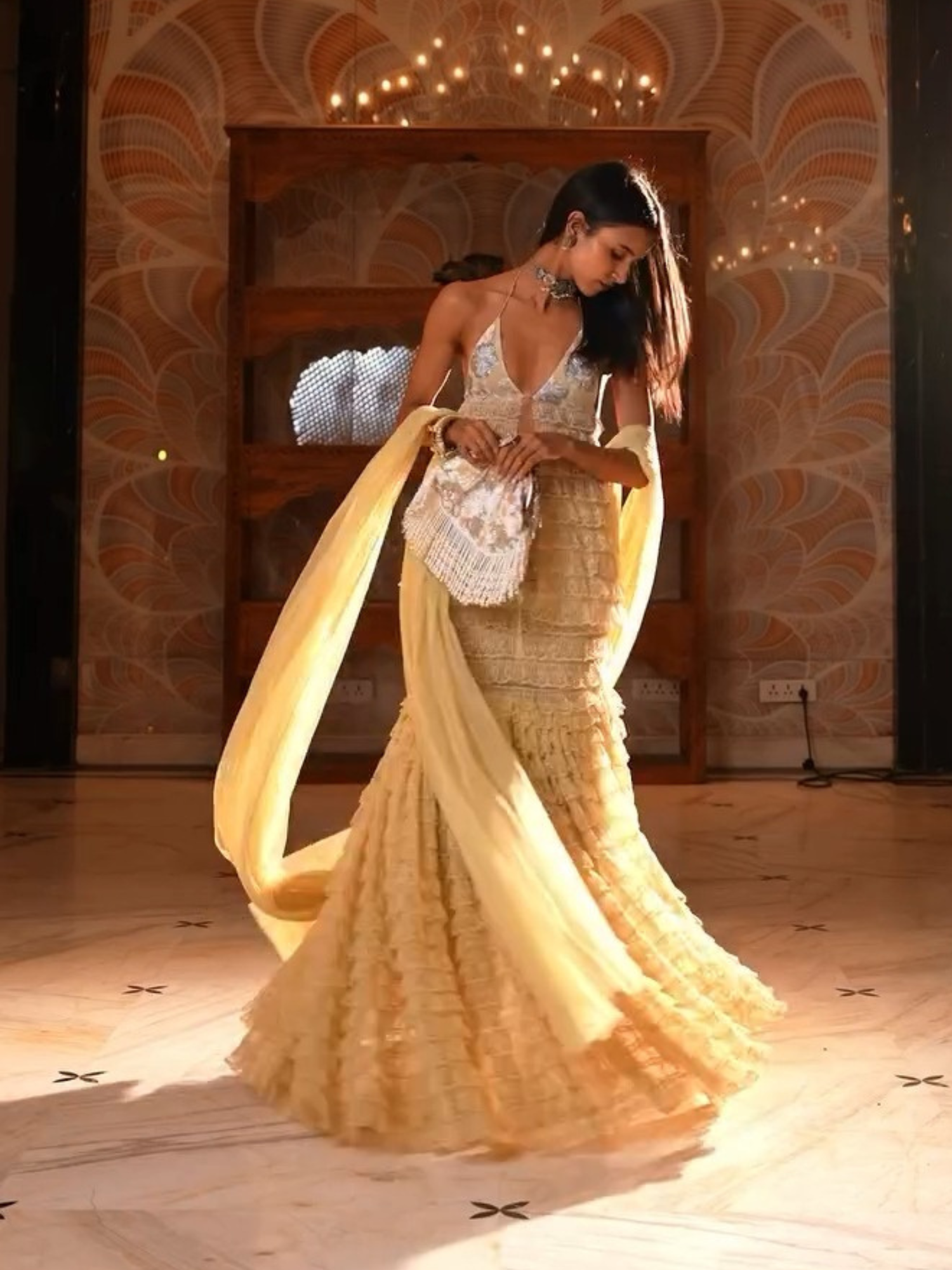 Kalki Kochelin Belle Fluer hand-embroidered batua with floral design, crafted by aclutchstory, showcasing intricate embroidery and vibrant colors.