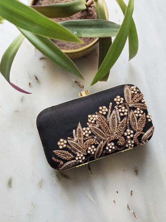 Black Dabka leaf clutch by aclutchstory with intricate embroidery and a sleek design, perfect for elegant occasions.