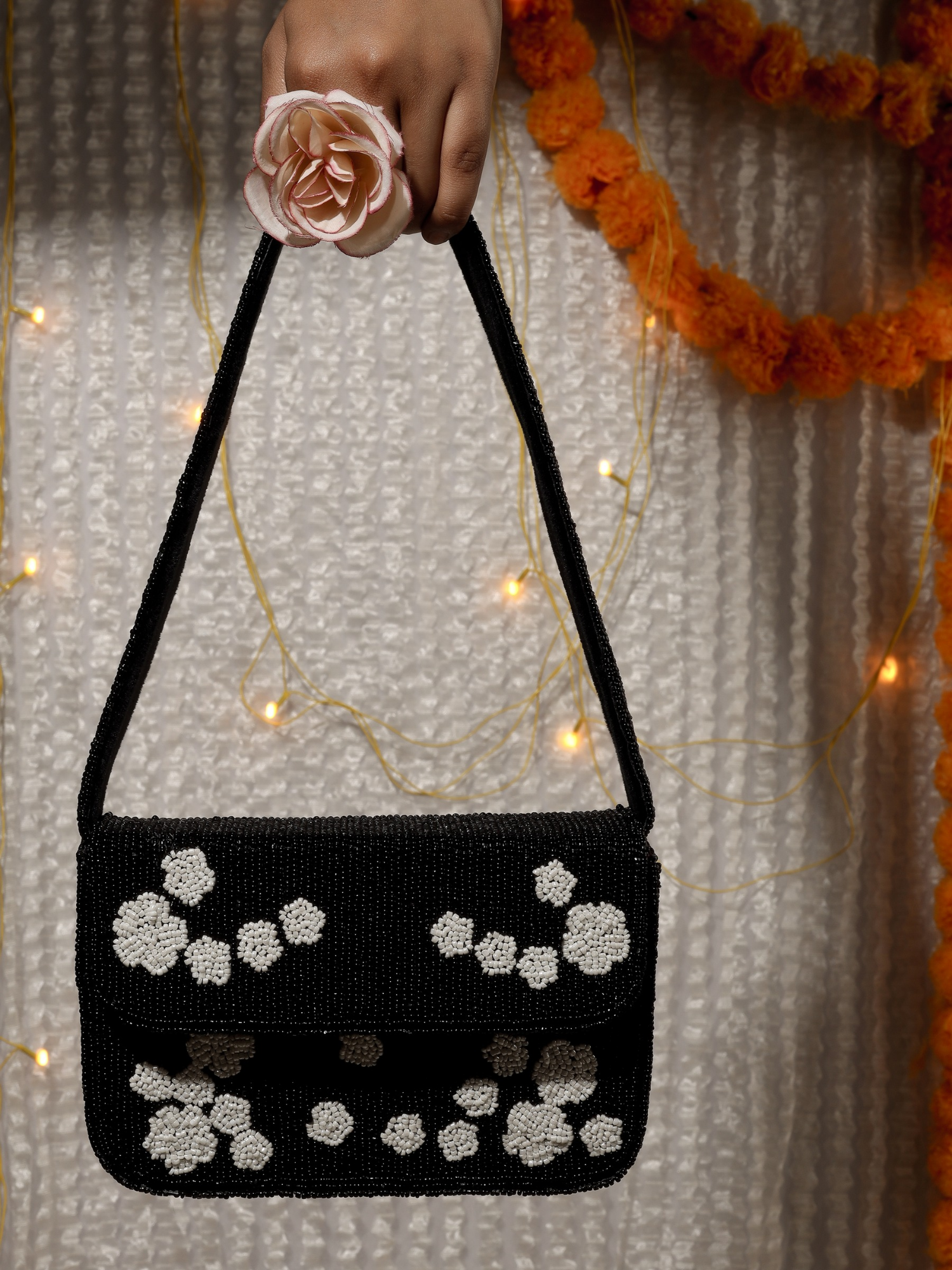 Black rose beaded purse by aclutchstory featuring intricate beadwork and floral rose design for elegant occasions.
