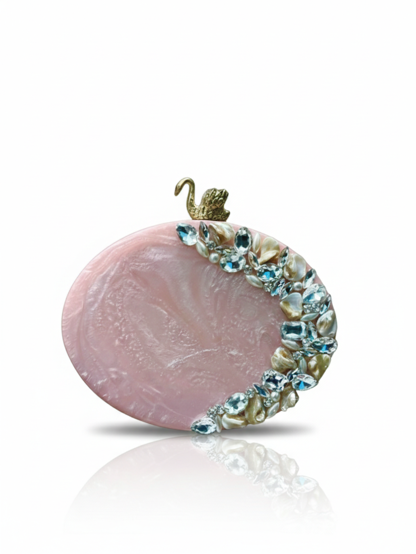 Resin oval clutch featuring stone work on a beautiful blush pink color. 