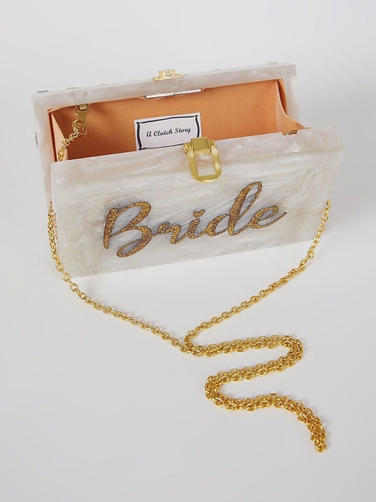 Set of 10 customized engraved two-way clutches in various colors, featuring personalized designs and compact, stylish shapes.