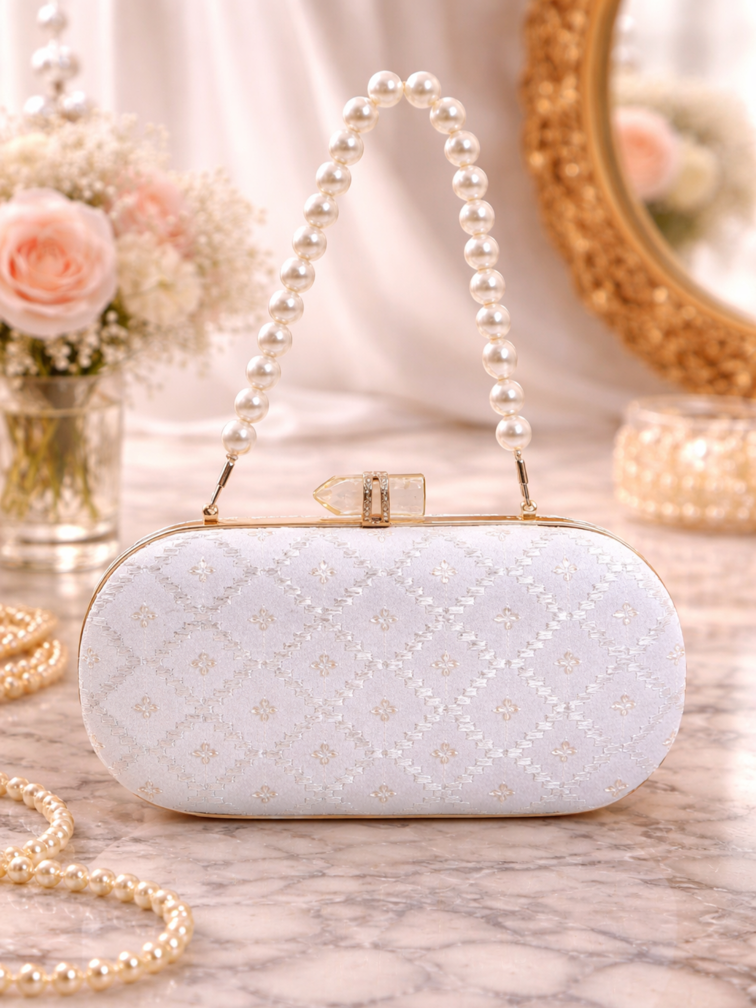 Embroidered Chandni capsule clutch bag by aclutchstory with intricate embroidery and compact design for elegant occasions