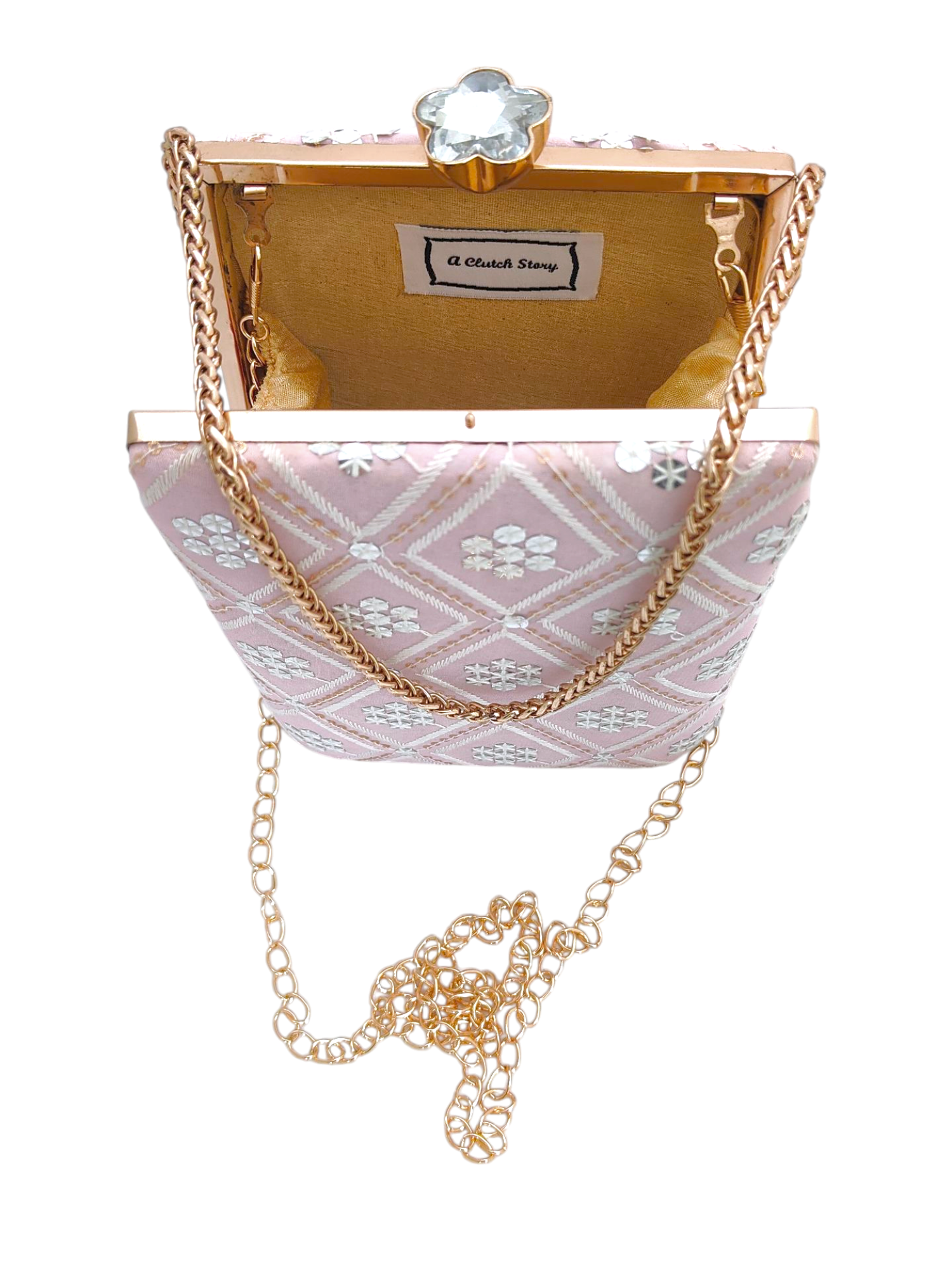 Dusty pink Fajr clutch by aclutchstory featuring a sleek, compact design with a textured surface and elegant gold-tone hardware.