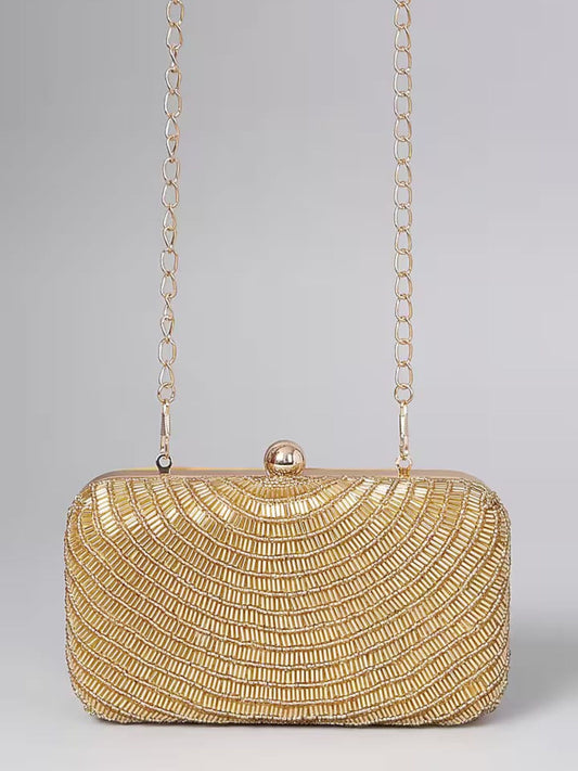 Gold beaded clutch bag with intricate beadwork, stylish accessory by aclutchstory for evening events and formal occasions.