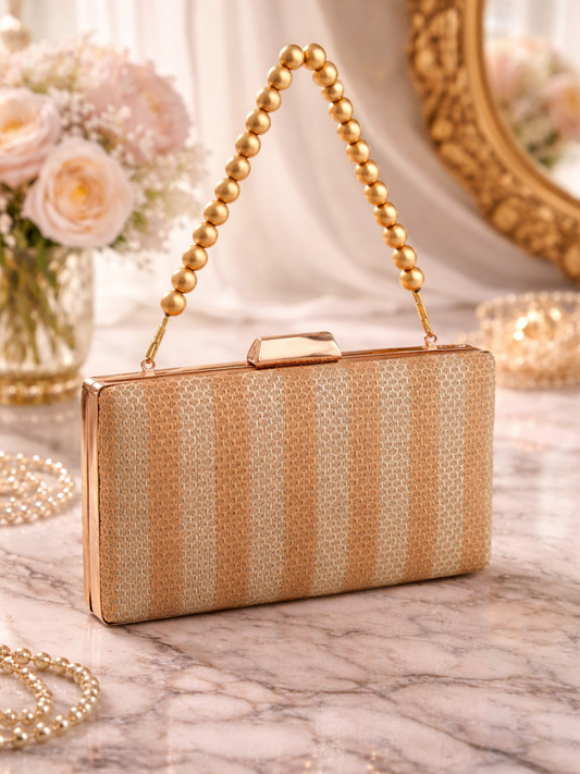 Gold Garba silk clutch bag with intricate embroidery and embellishments, stylish accessory for festive and special occasions.