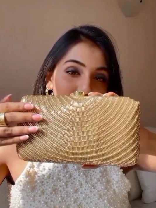 Gold Cleopatra clutch bag by Masoom Minawala featuring intricate design, perfect for evening events and special occasions.