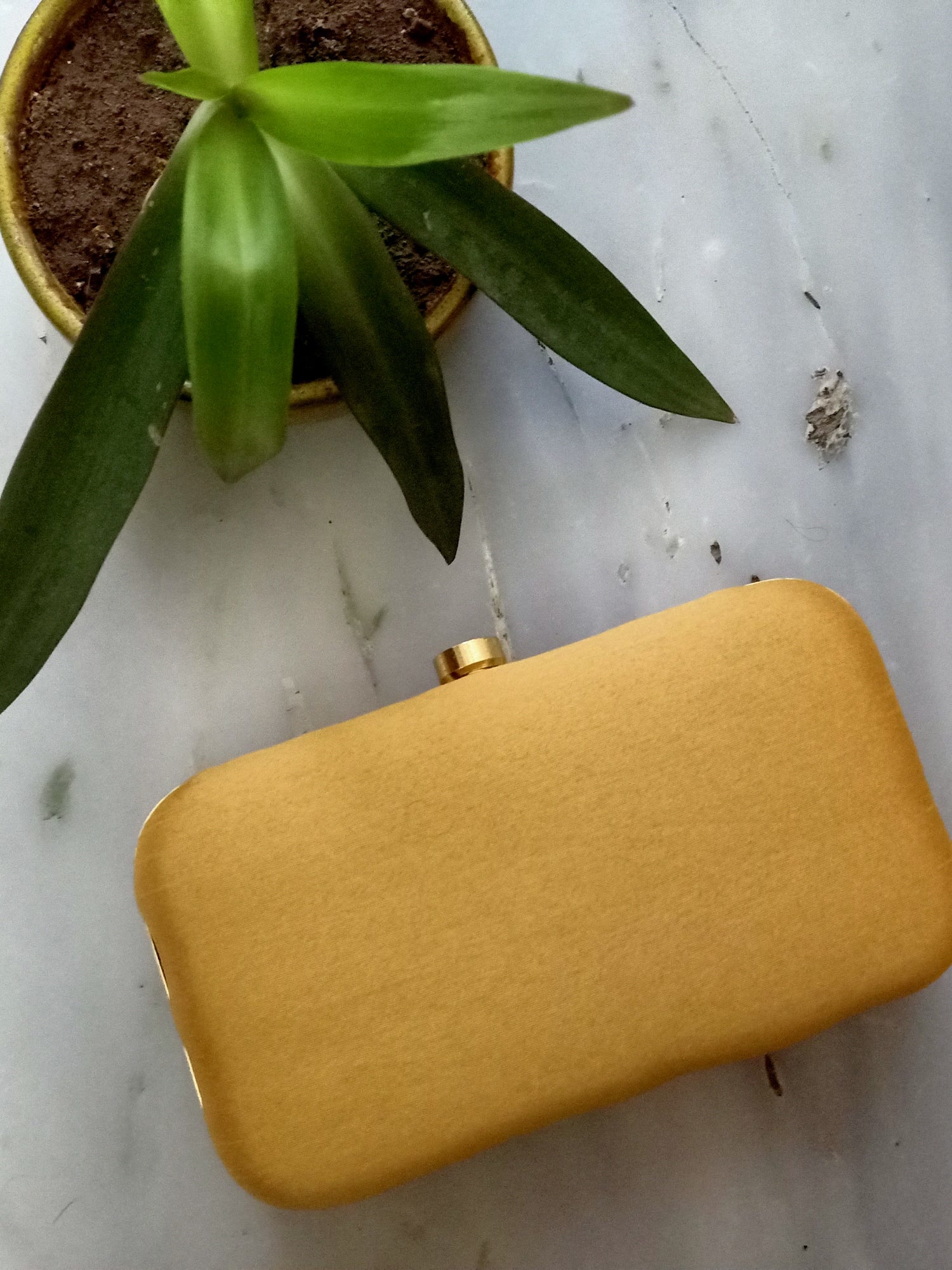 Gold Cleopatra clutch handbag by Masoom Minawala from aclutchstory, featuring elegant design and metallic finish.