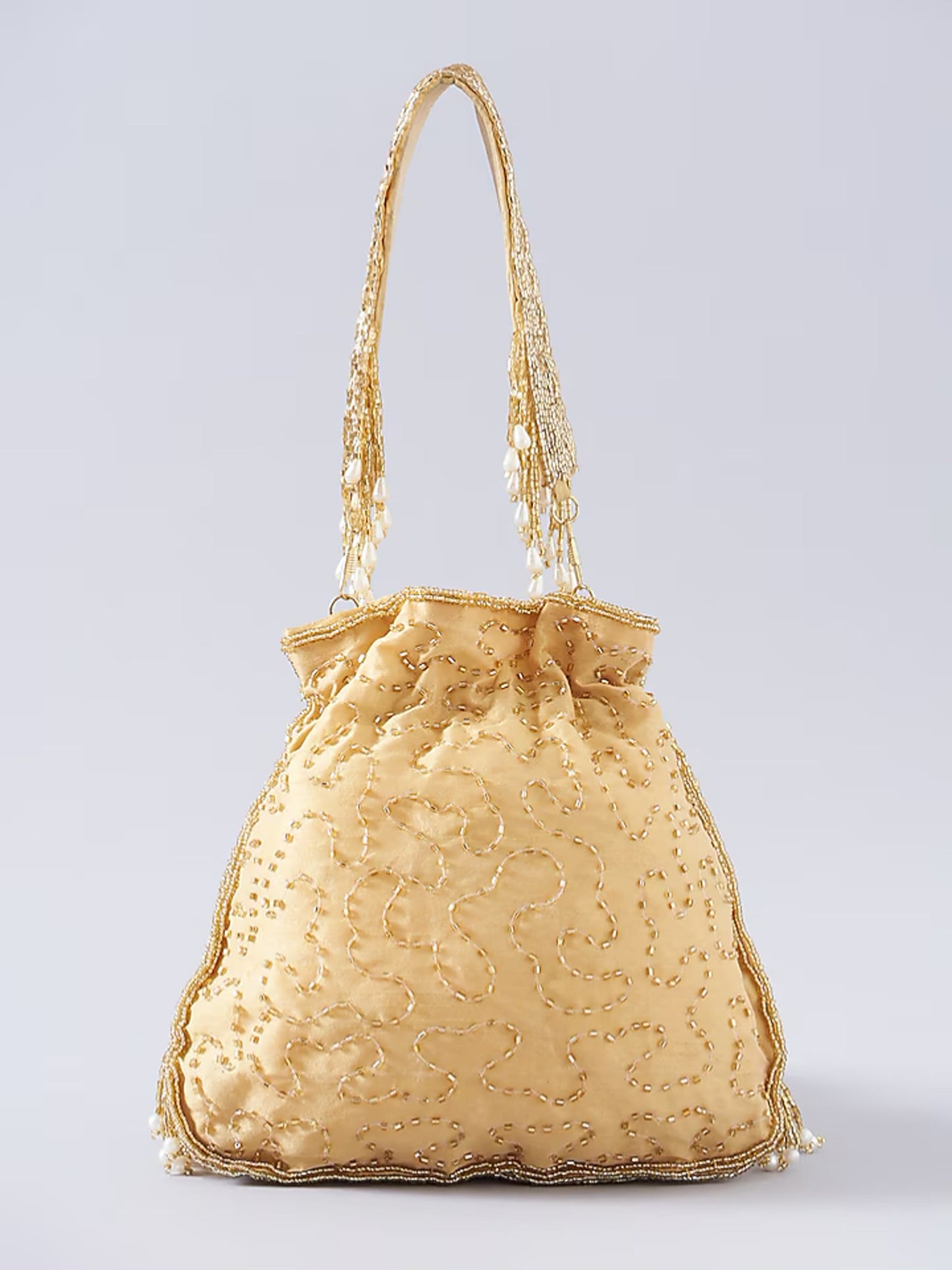 Gold fringe glam potli bag with intricate detailing, perfect for traditional or festive occasions.