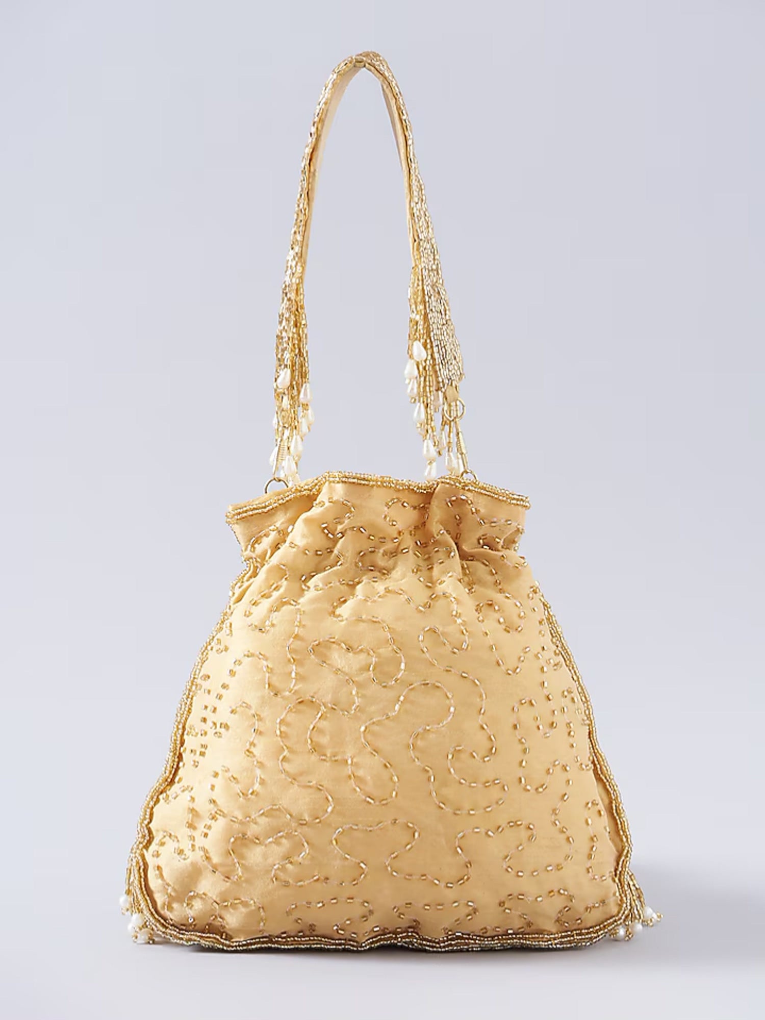 Gold fringe glam potli bag with intricate detailing, perfect for traditional or festive occasions.