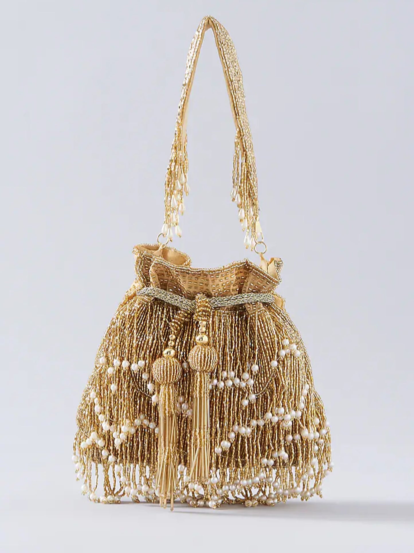 Gold fringe glam potli bag with intricate embroidery and drawstring closure, perfect for traditional or festive occasions.