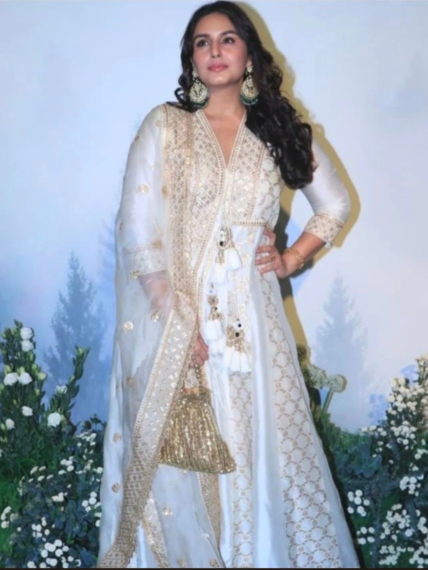 Gold sequins hand-embroidered potli bag with intricate embroidery, perfect for festive occasions, by aclutchstory.