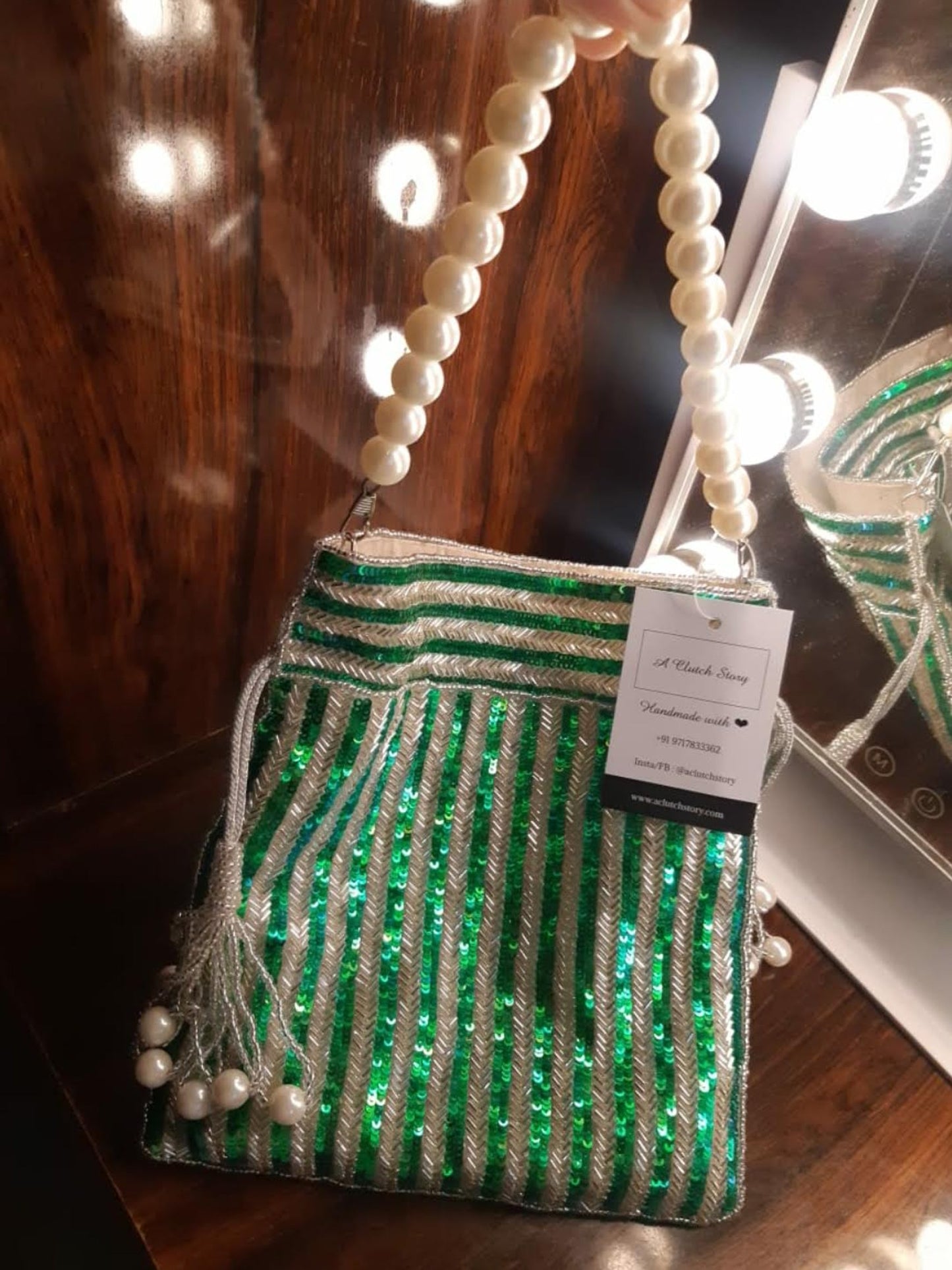 Green Sequins Handembroidered Potli (With minor imperfections)