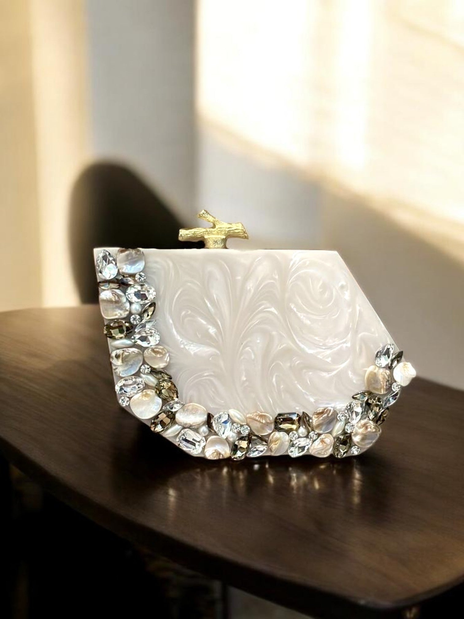 Ivory Aura clutch bag by aclutchstory with sleek design and gold clasp, perfect for evening or special occasions.