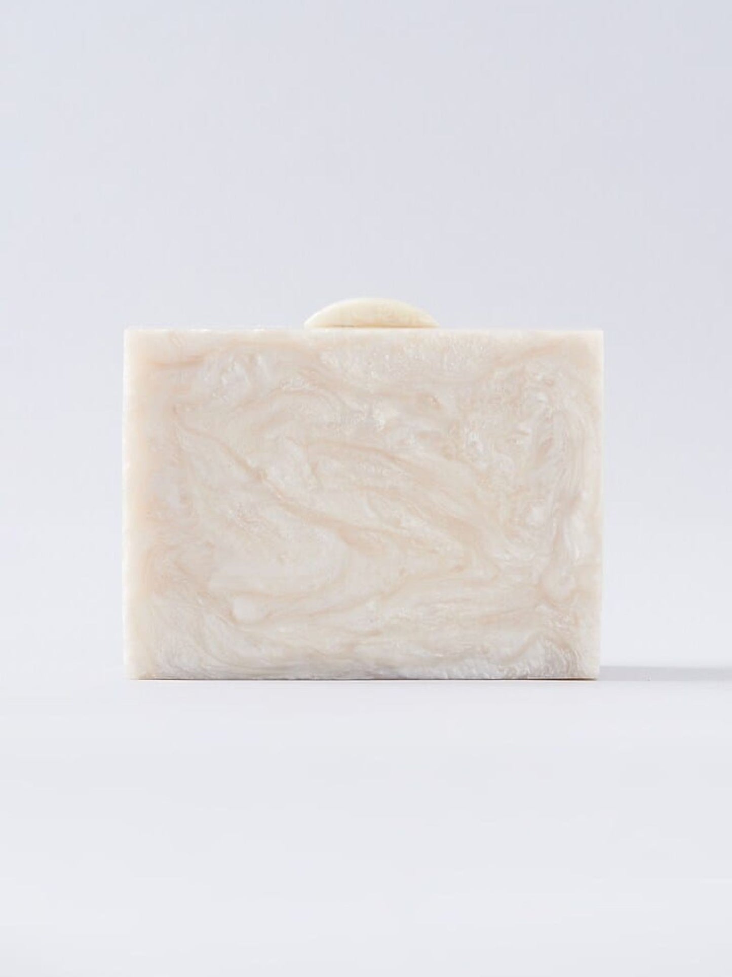 Ivory embellished resin clutch bag with decorative accents, designed by aclutchstory for elegant evening wear.