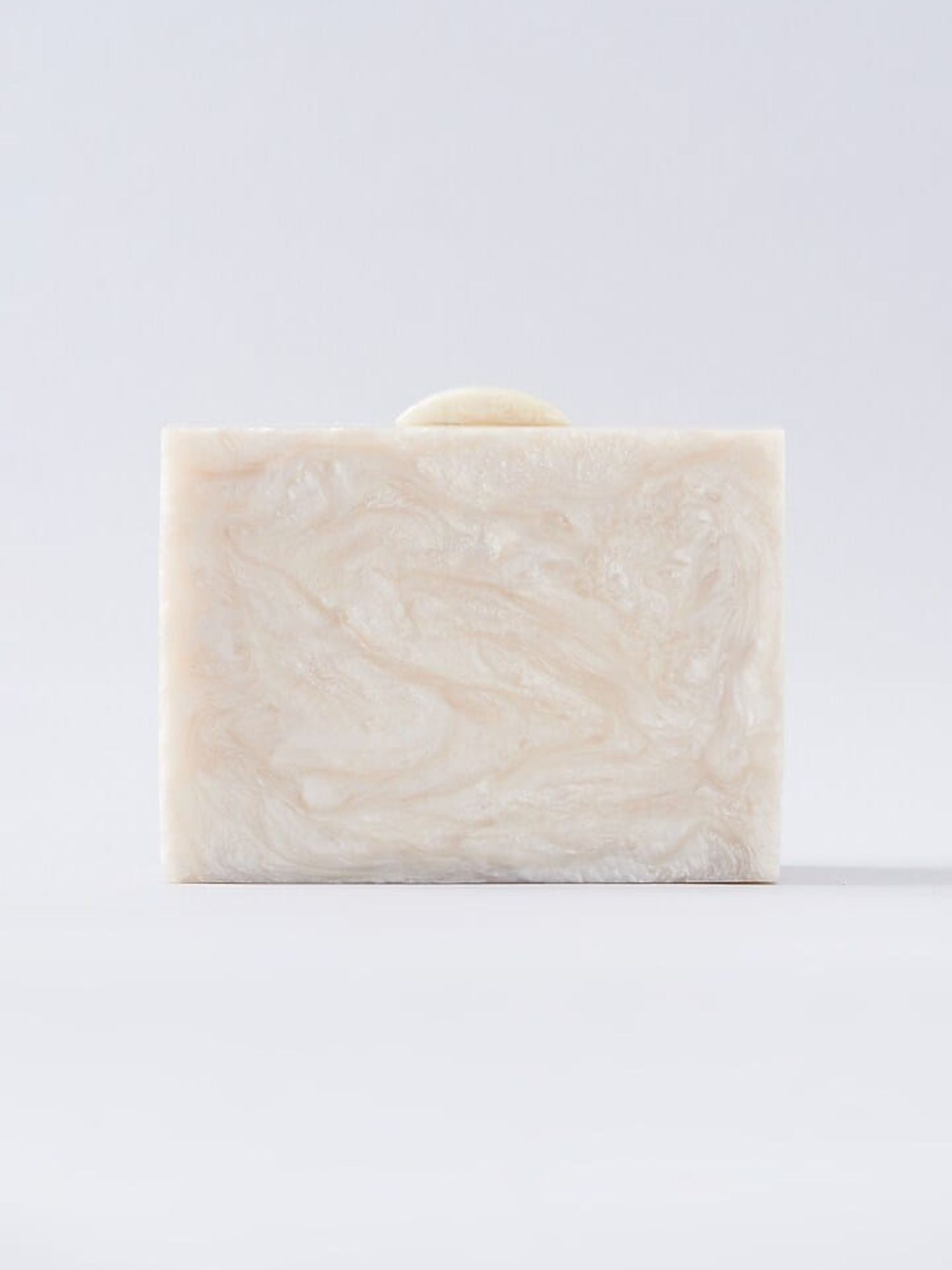 Ivory embellished resin clutch bag with decorative accents, designed by aclutchstory for elegant evening wear.