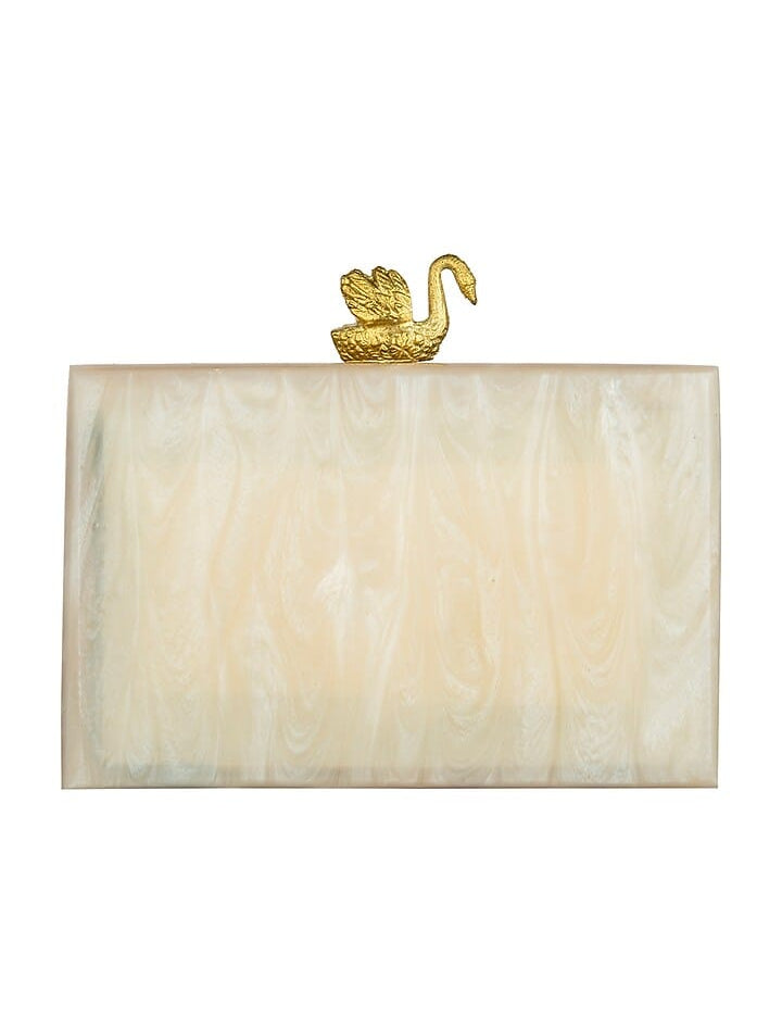 Ivory resin clutch bag shaped like a swan with intricate detailing, designed by aclutchstory.