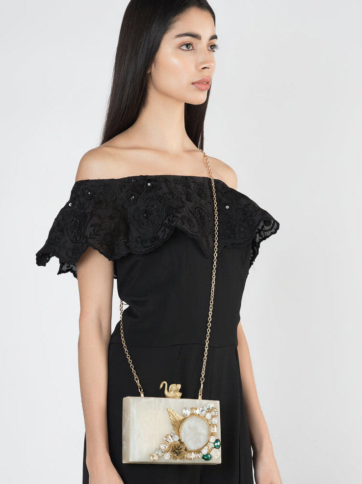 Ivory swan-shaped resin clutch bag with detailed feather texture, designed by aclutchstory for elegant evening accessories.