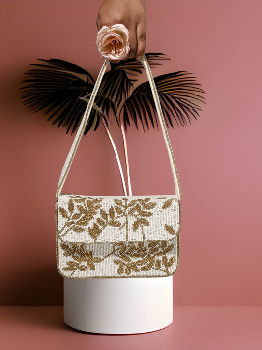 Ivory and gold gleam clutch purse with metallic finish and elegant design, perfect for evening events and special occasions.