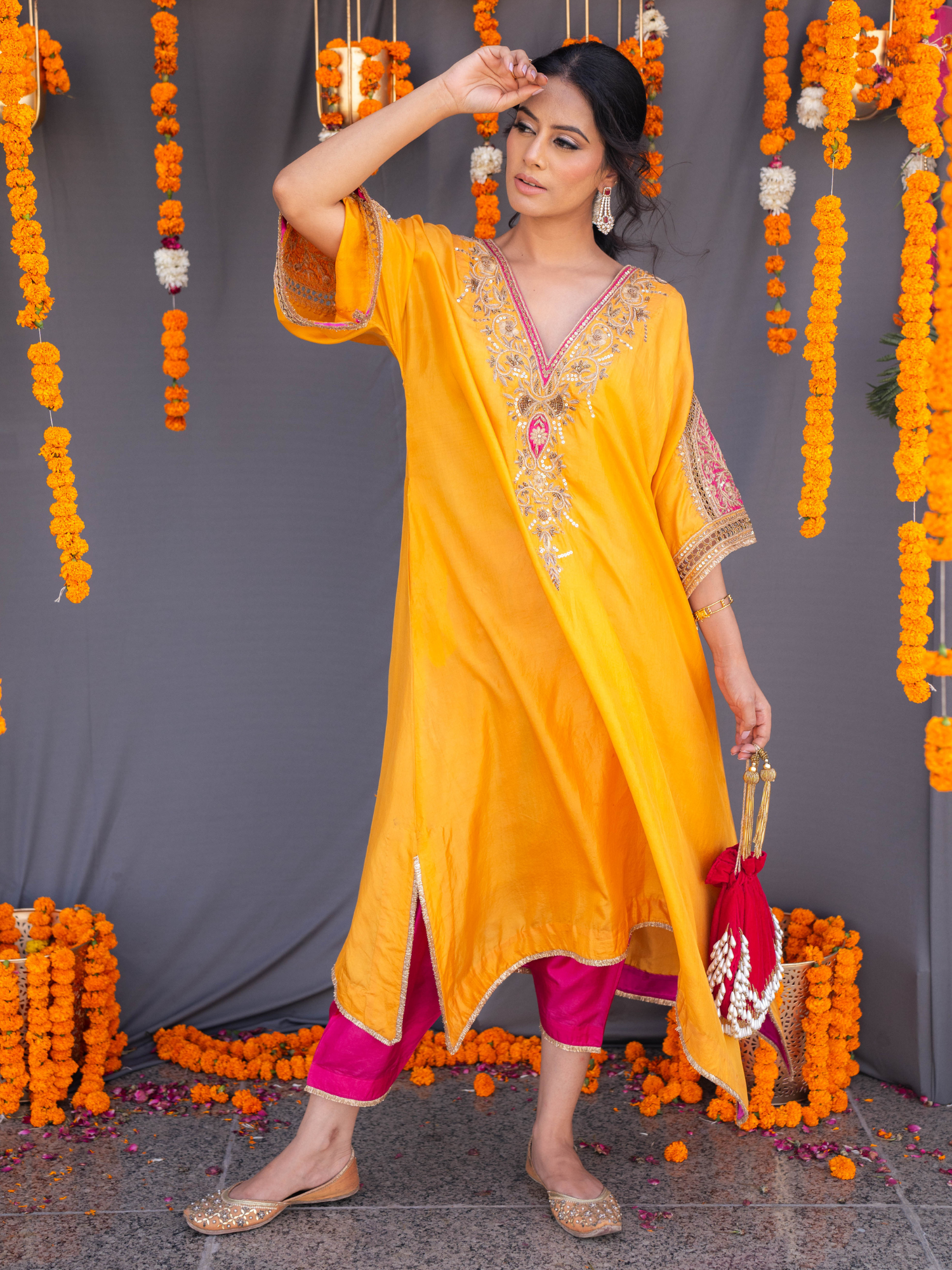 Elegant pearl tassels potli bag by aclutchstory with intricate embroidery and traditional design, perfect for special occasions.