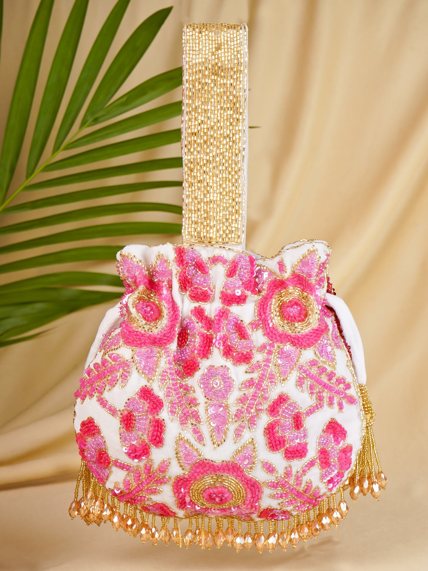 Rosy Dreams dual-colored Potli Bag with intricate embroidery, featuring a drawstring closure and traditional design.