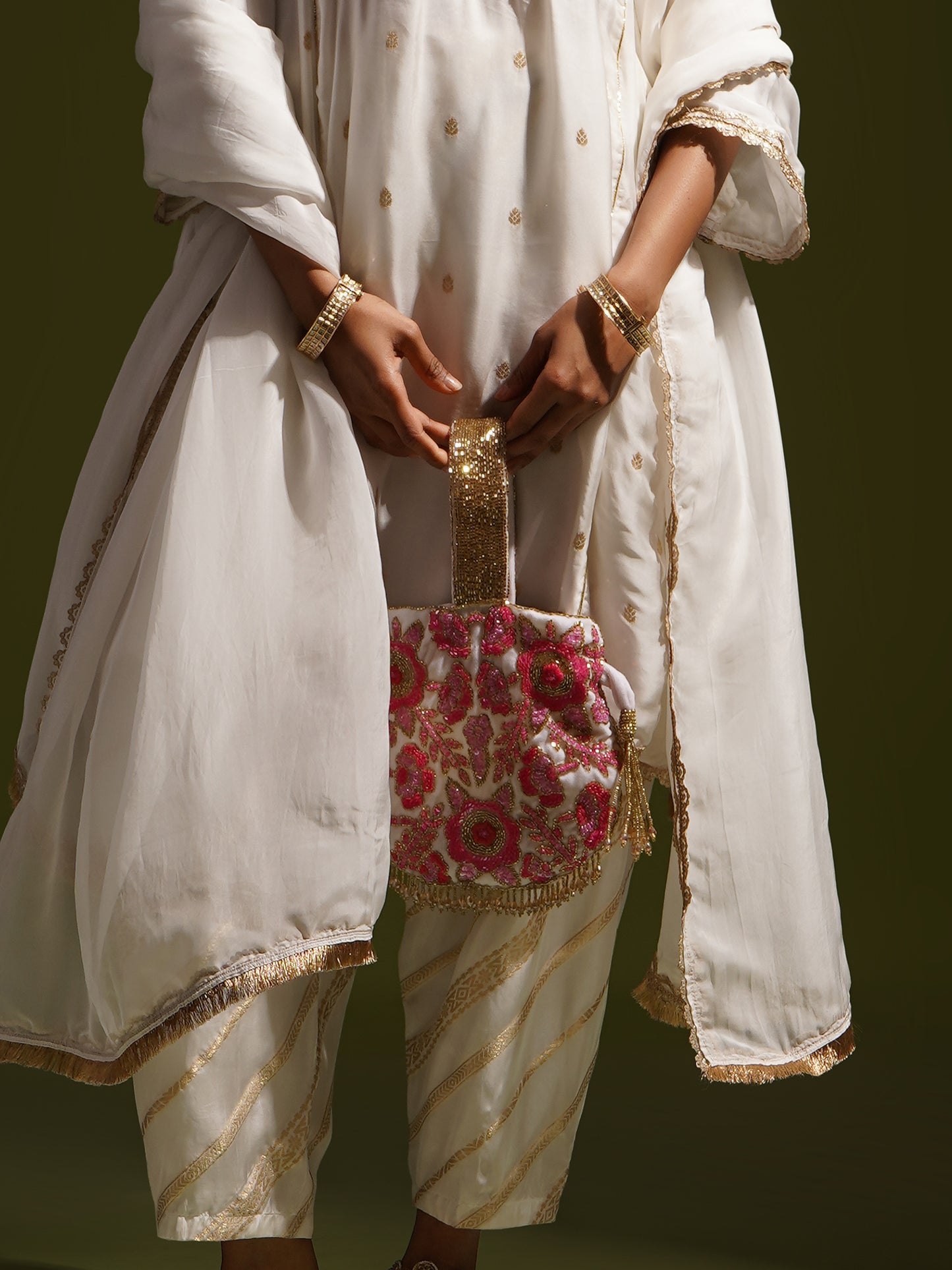 Rosy Dreams dual-colored Potli Bag by aclutchstory, featuring intricate embroidery and traditional design for elegant occasions.