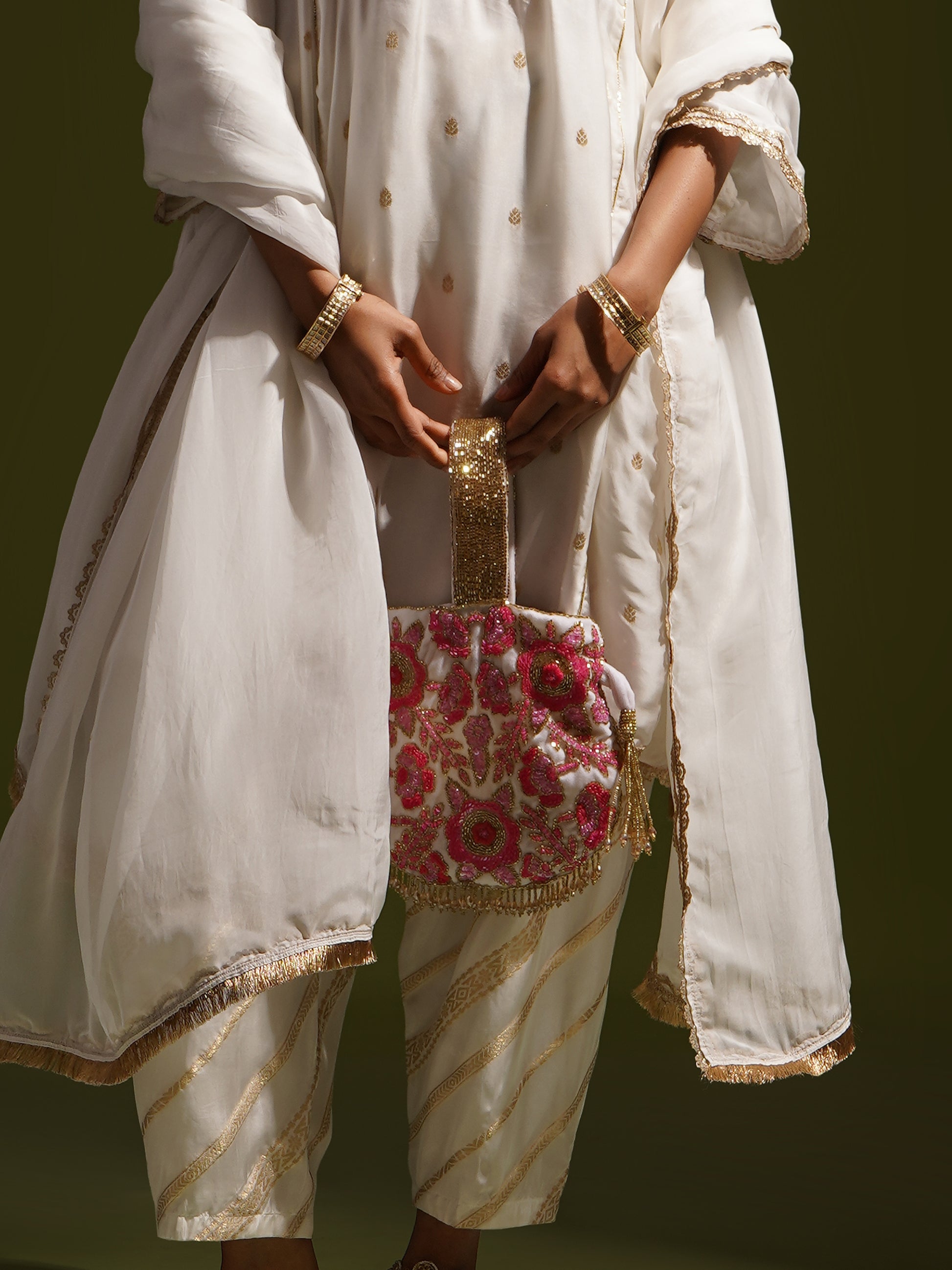 Rosy Dreams dual-colored Potli Bag by aclutchstory, featuring intricate embroidery and traditional design for elegant occasions.