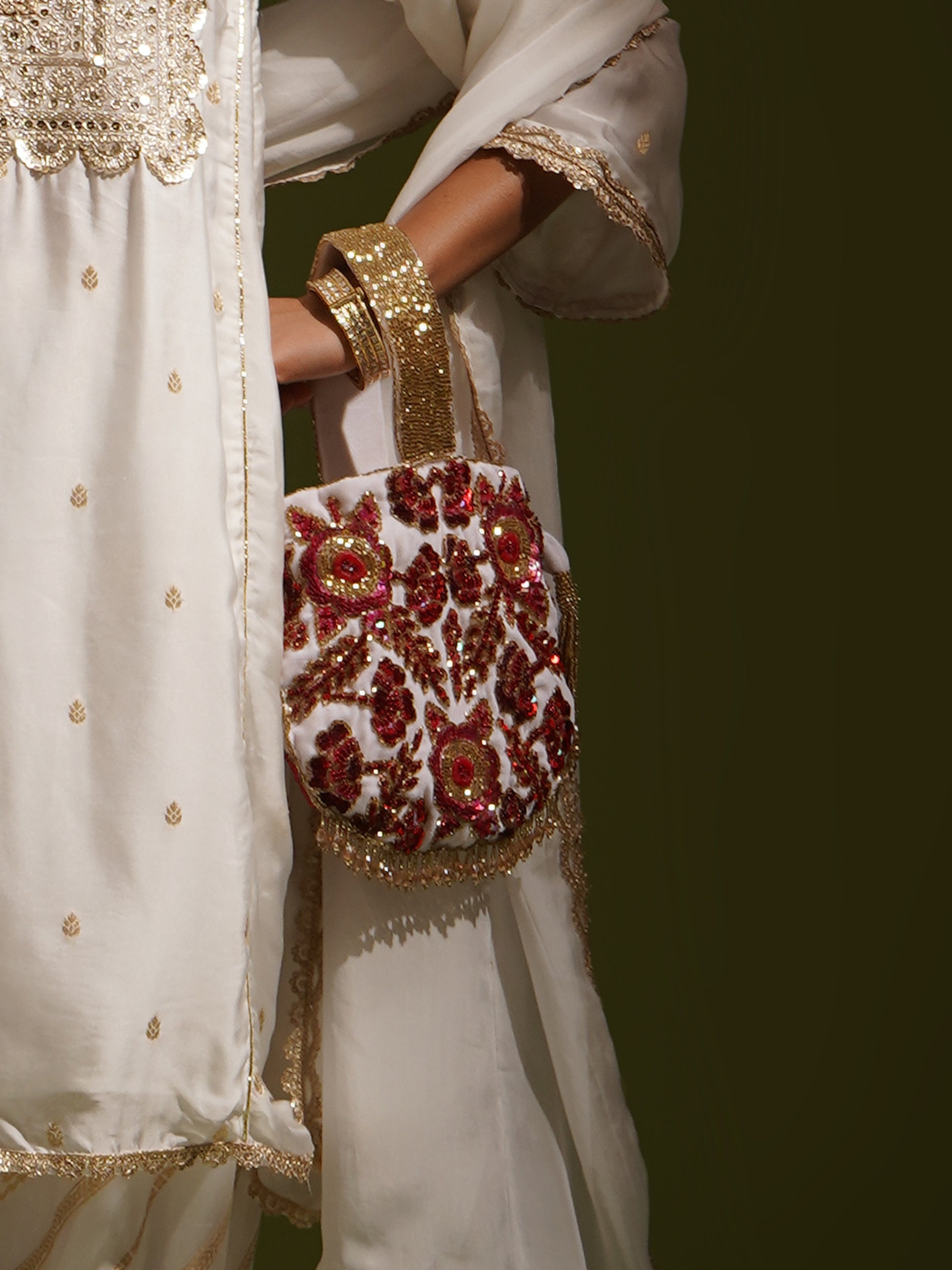 Rosy Dreams dual-colored Potli Bag by aclutchstory with intricate embroidery and a drawstring closure, perfect for traditional occasions.