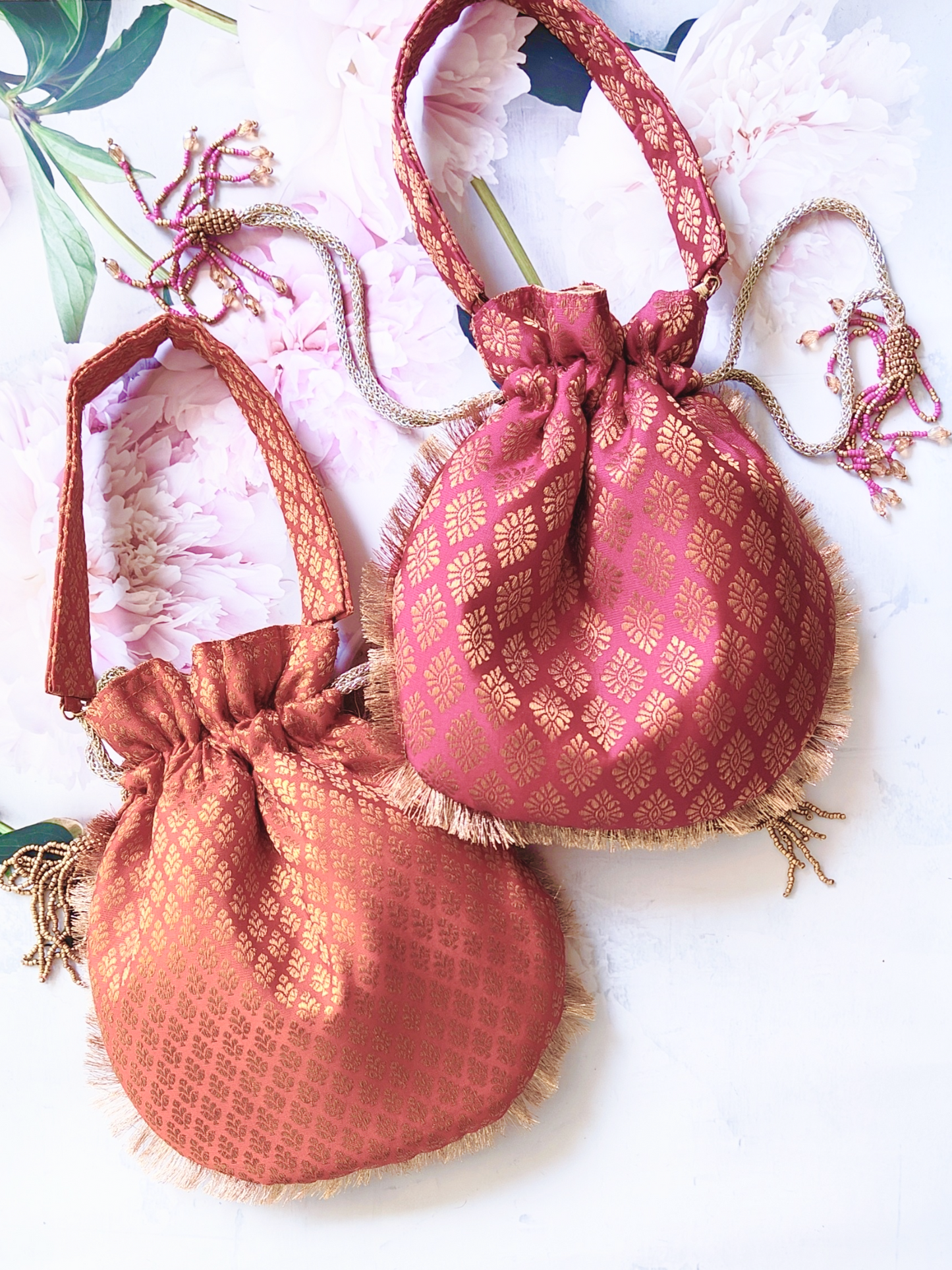 Set of 4 Banarasi Potlis with intricate gold and colorful embroidery, traditional Indian clutch bags for festive occasions