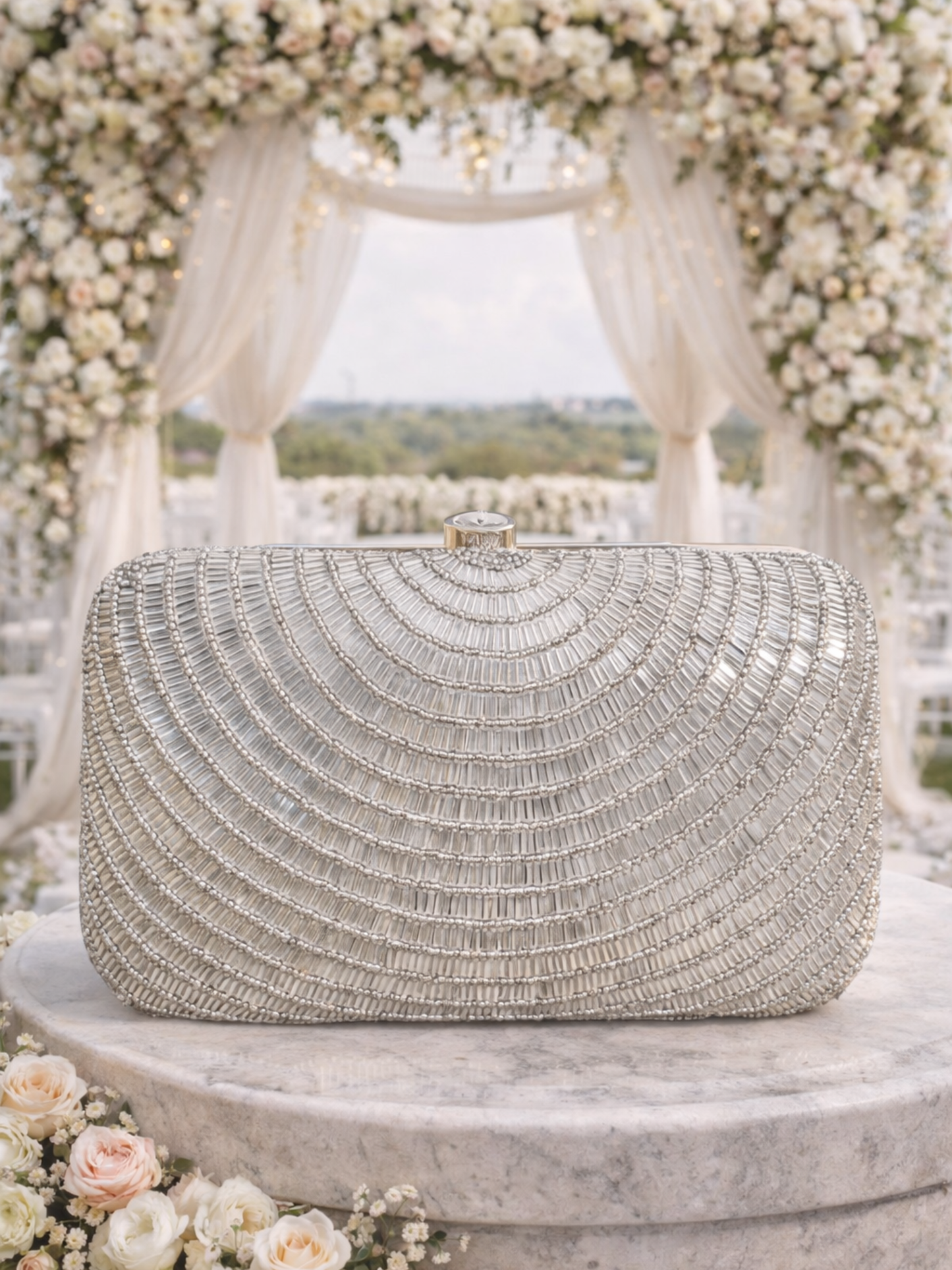 Silver Cleopatra clutch bag by Shaheen Bhatt featuring a sleek design with elegant embellishments.