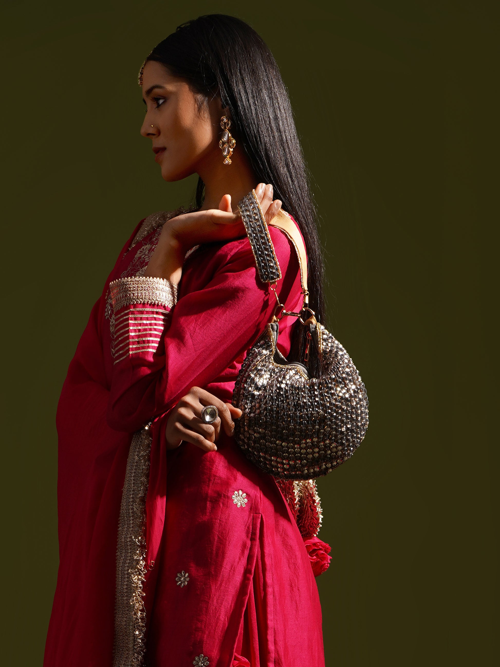 Smokey Topaz clutch purse by aclutchstory with sleek design and metallic accents, shown on a plain background.