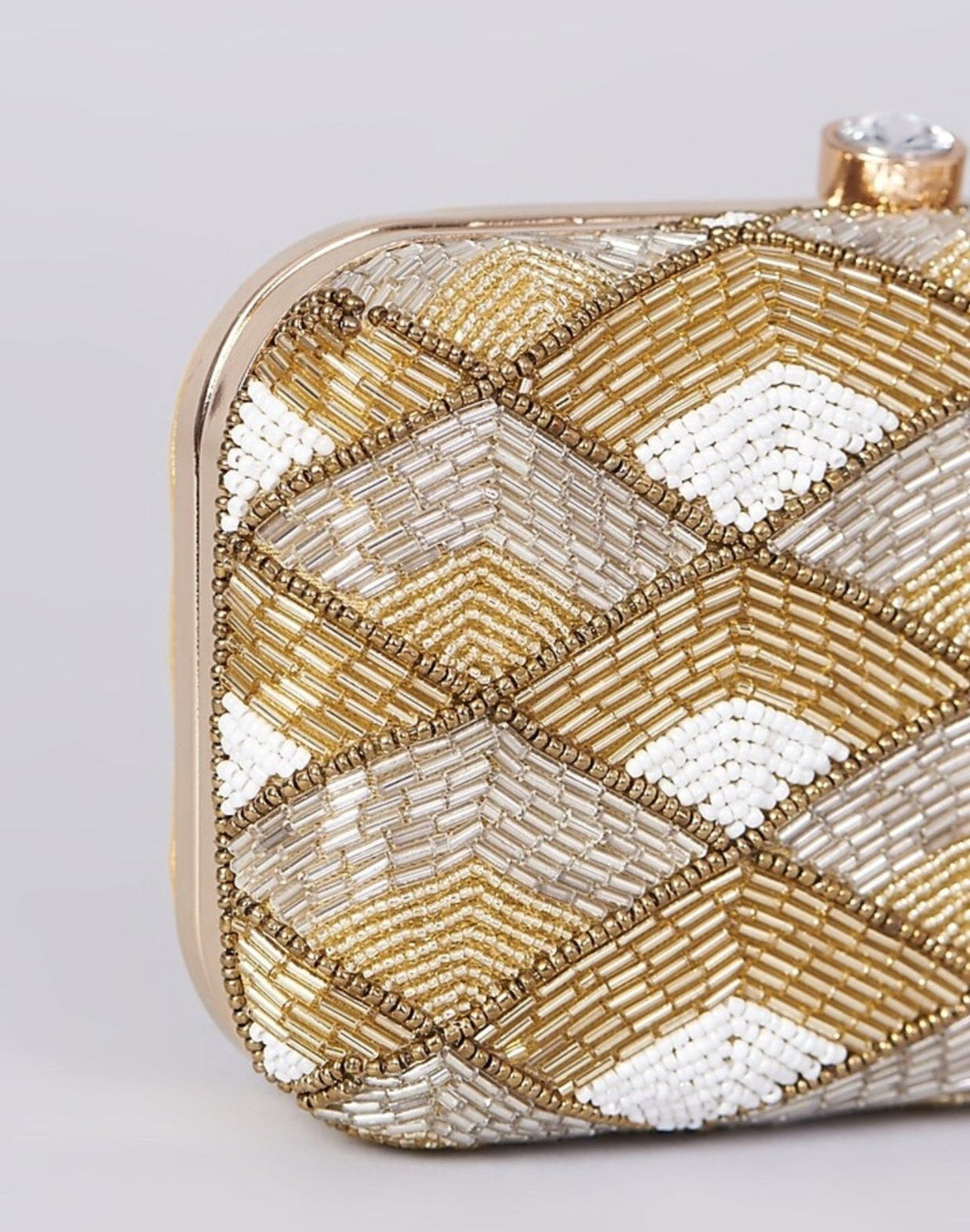 Tricolored hand-embroidered clutch bag with intricate embroidery and vibrant design, crafted by aclutchstory.