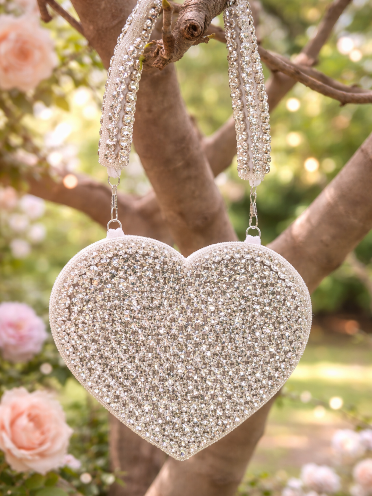 Silver Queen of Hearts clutch bag by aclutchstory with intricate heart design and elegant rectangular shape.