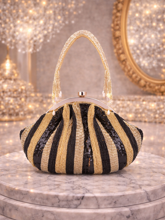 Black Shine on Pouch by aclutchstory, last piece left, featuring a sleek, shiny black design with a stylish, compact appearance.