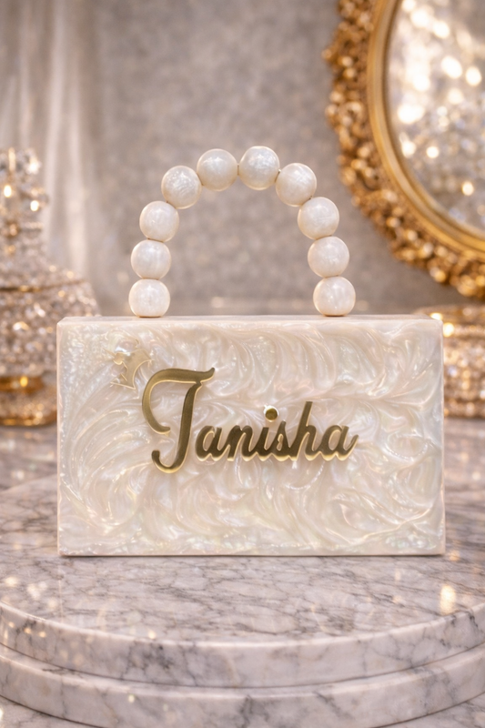 White customized embossed clutch bag with textured surface, stylish accessory from aclutchstory for elegant occasions.