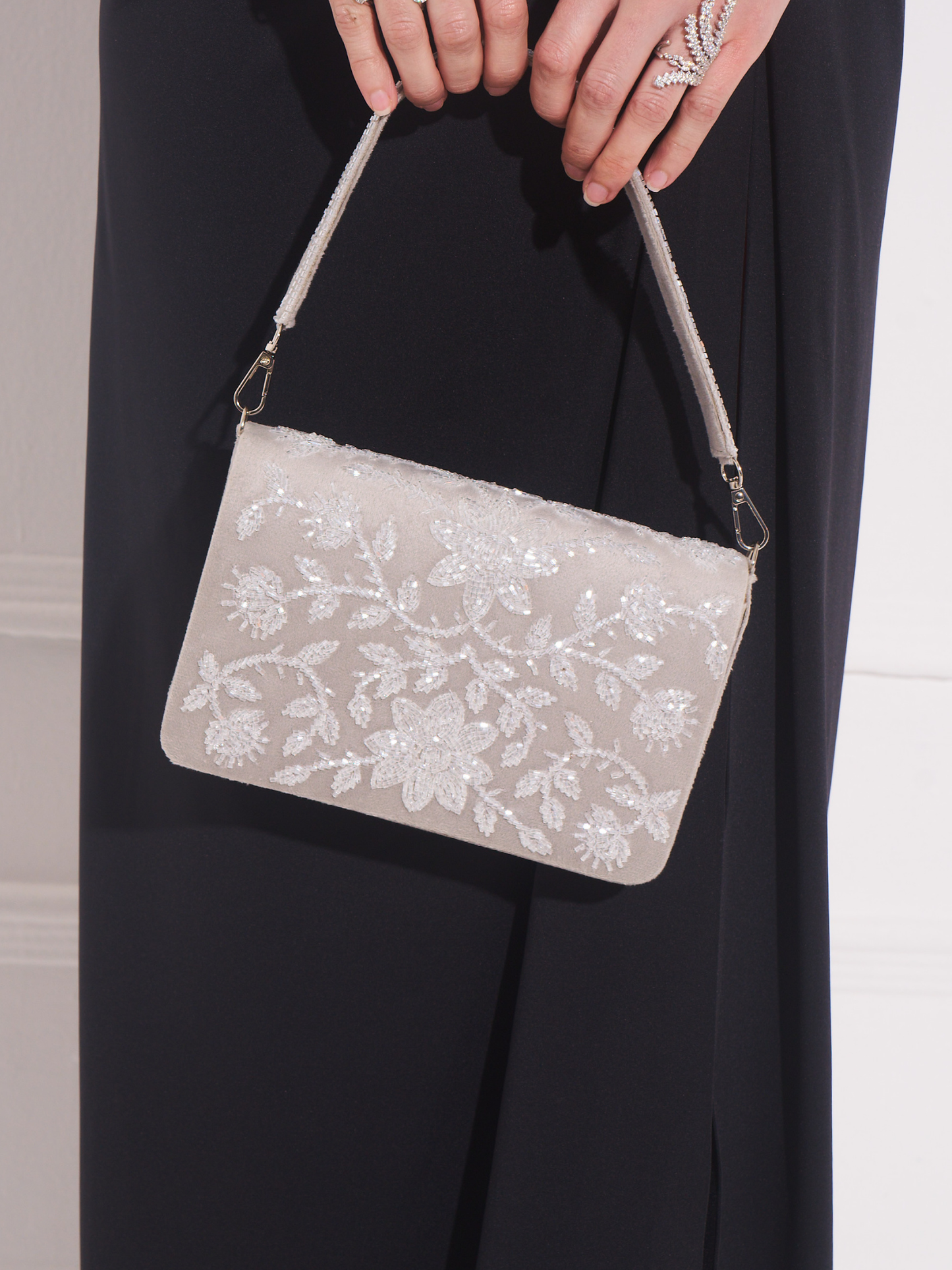 Hand-embroidered Sitara flapover clutch by aclutchstory, featuring intricate floral embroidery and elegant design.